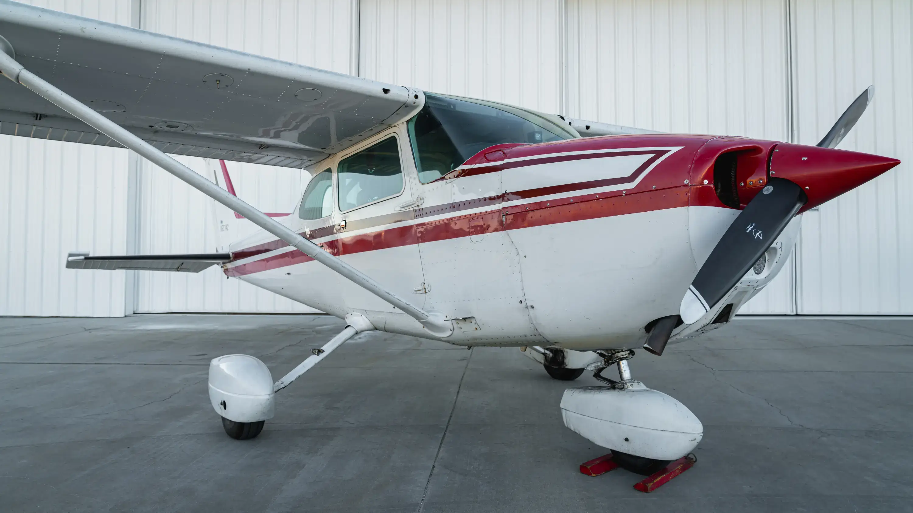 N53742 Cessna 172P outside view of aircraft inside hangar at Lancaster California