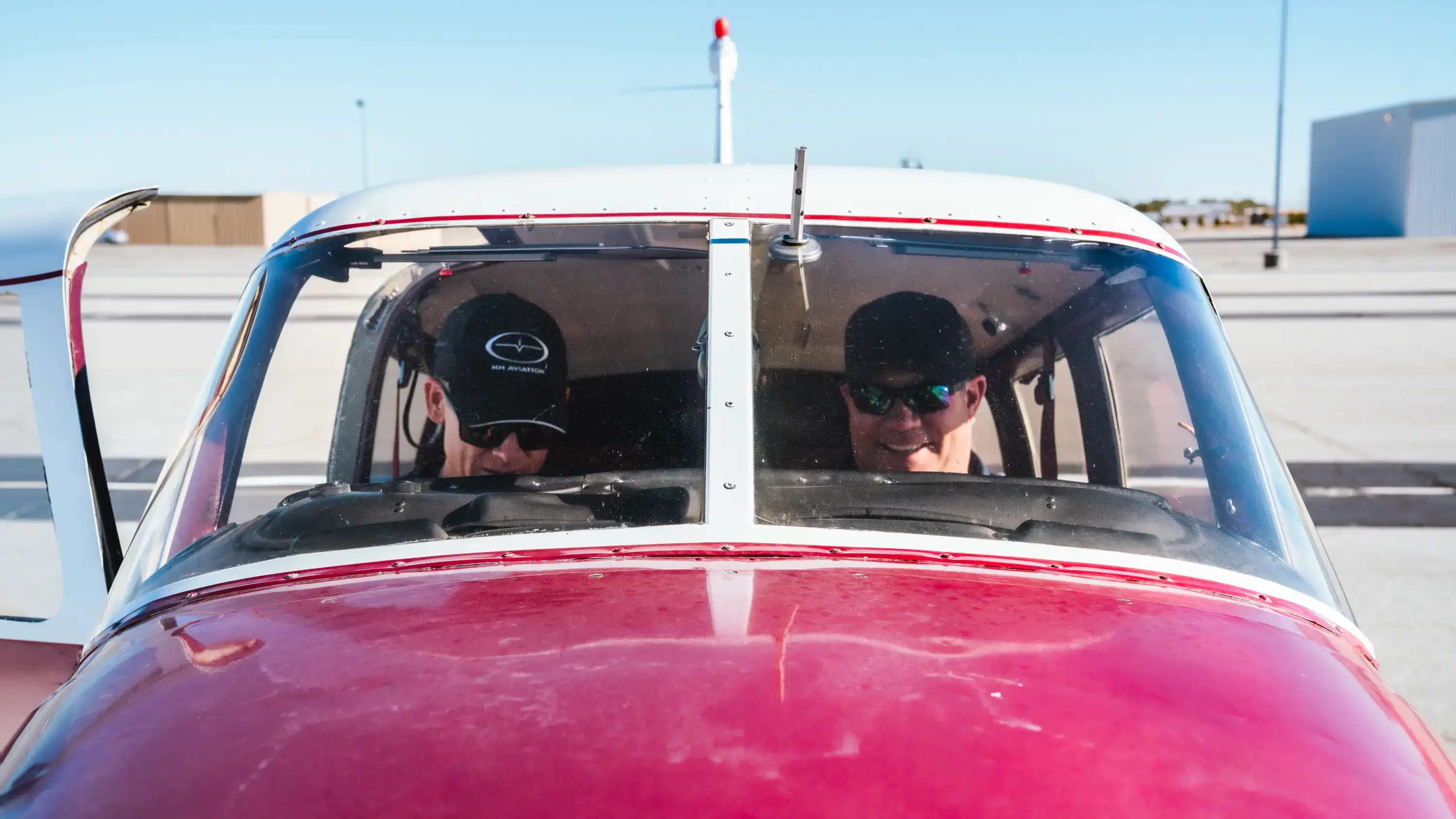 MH Aviation instructor with student inside cockpit