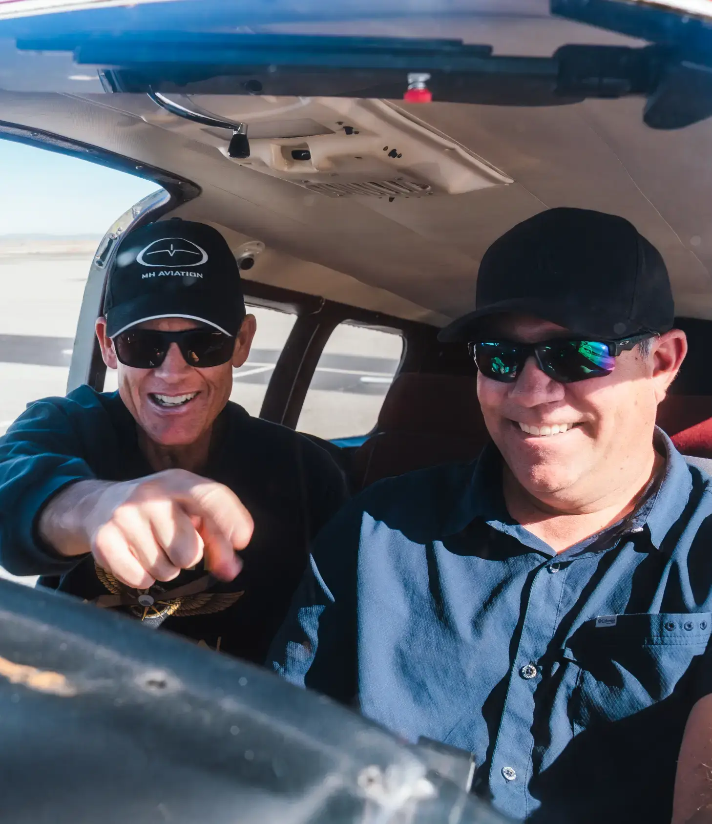 Happy student pilot in cockpit